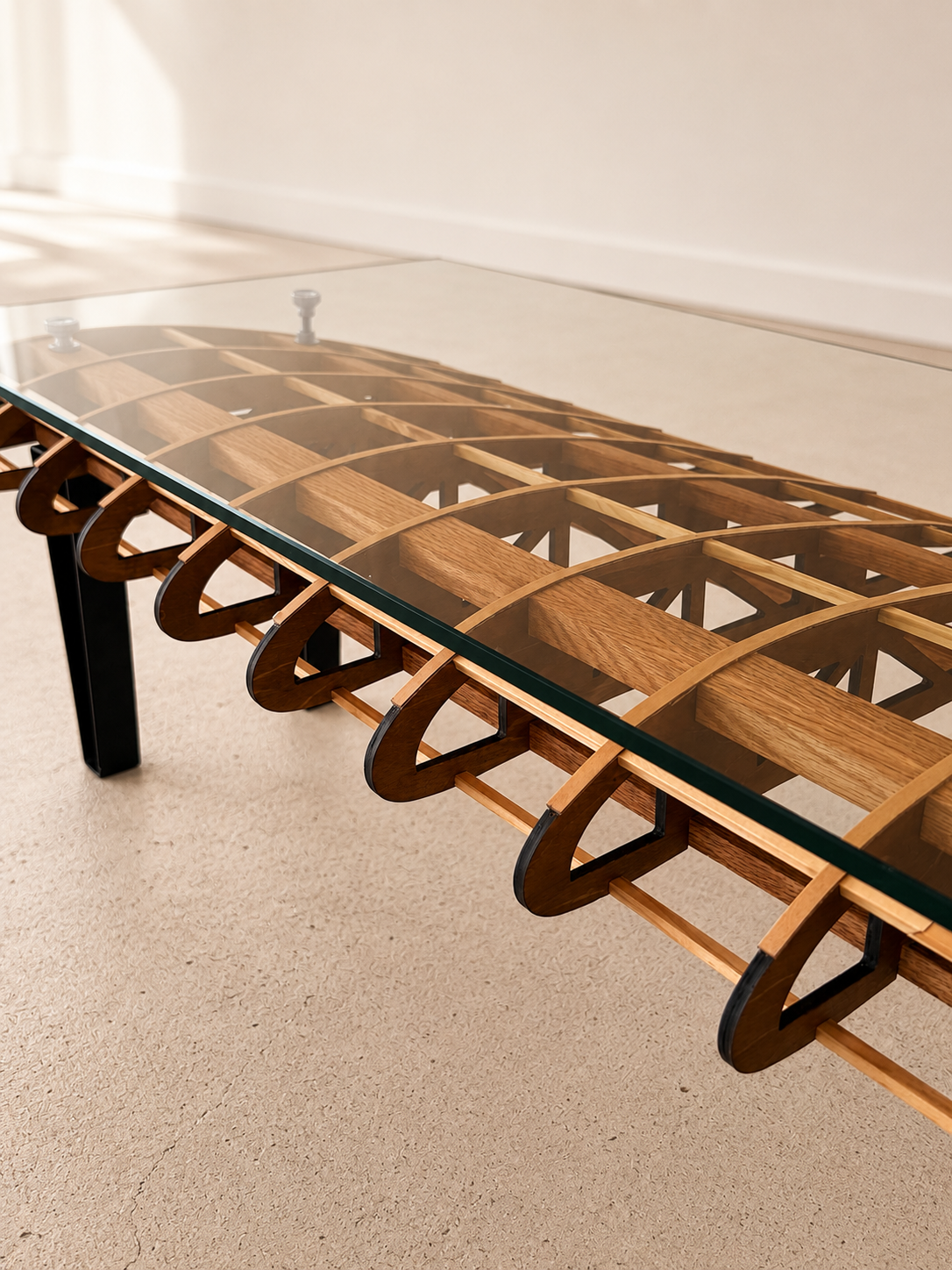 Flightline Furniture Short Final wing
                  rib coffee table — tempered glass and wing rib geometry detail — brass-finished hardware — Corvallis
                  Oregon
