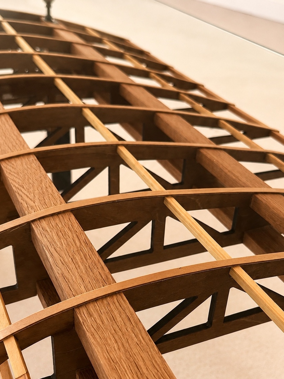 Flightline Furniture Short Final wing
                  rib coffee table — red oak grain and wing rib structure closeup — hand-selected board —
                  Corvallis Oregon