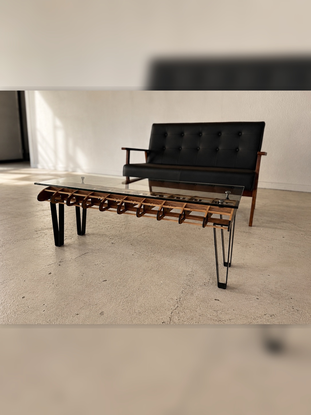 Flightline Furniture Short
                      Final wing rib coffee table — slight right angle styled in living room with black sofa —
                      Corvallis Oregon