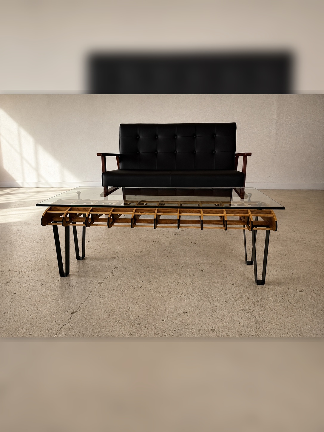 Flightline Furniture Short
                      Final wing rib coffee table — straight on view styled in living room with black sofa —
                      Corvallis Oregon