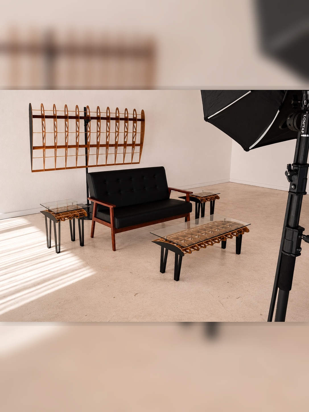 Flightline Furniture Side Slip
                      wing rib accent table — left side view styled with black sofa, Main Wing wall art, and lightbox —
                      full Flightline collection — Corvallis Oregon