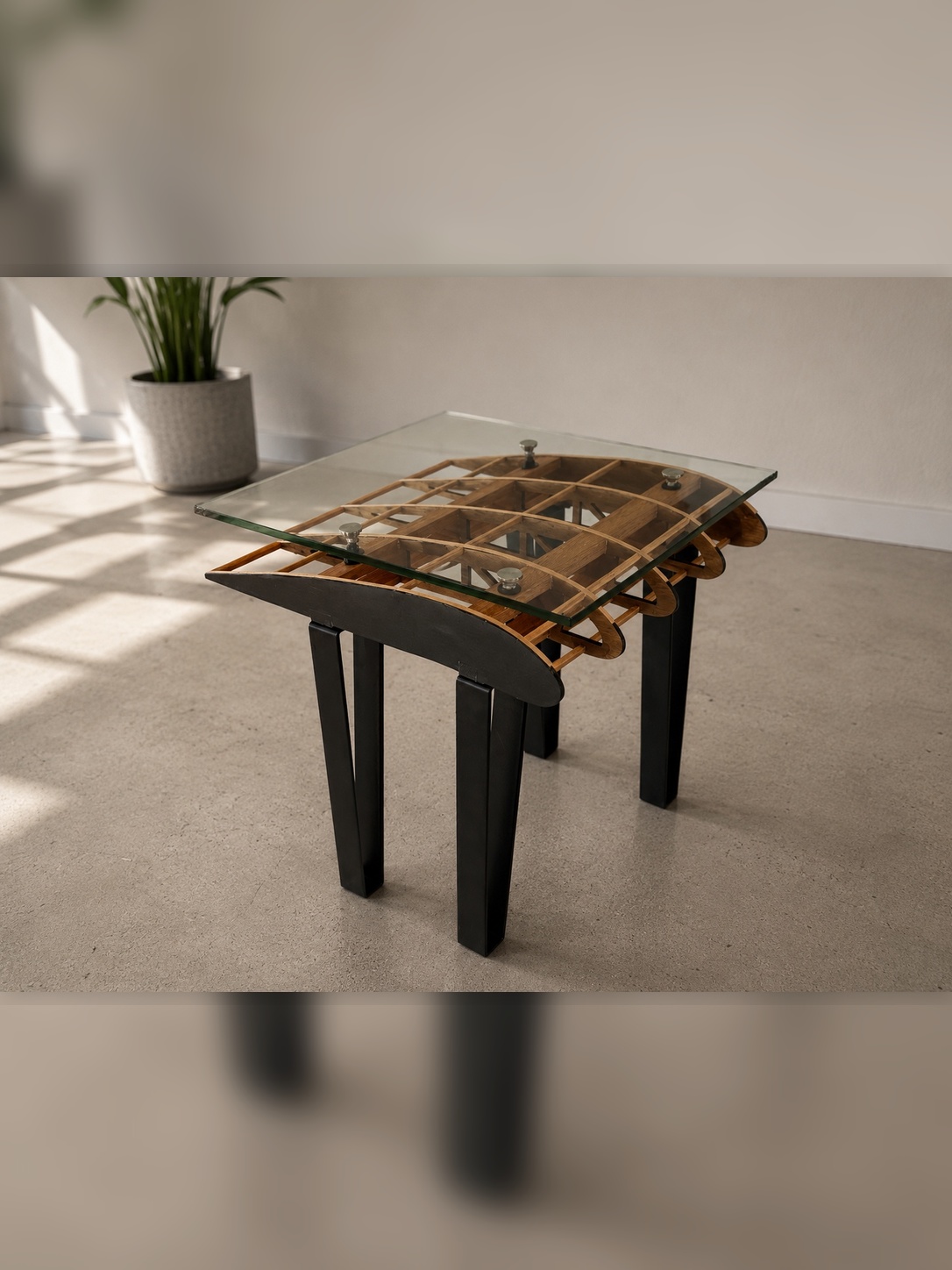 Flightline Furniture Side Slip wing
                   rib accent table — top side profile showing wing rib geometry — potted plant in background —
                   Corvallis Oregon