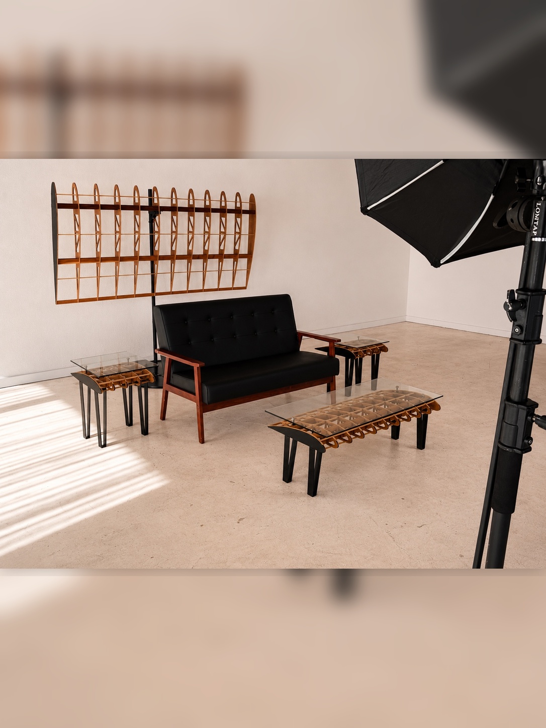 Flightline Furniture Main
                       Wing wing rib wall art — left side view styled with black sofa, Side Slip accent table,
                       and lightbox — full Flightline collection — Corvallis Oregon